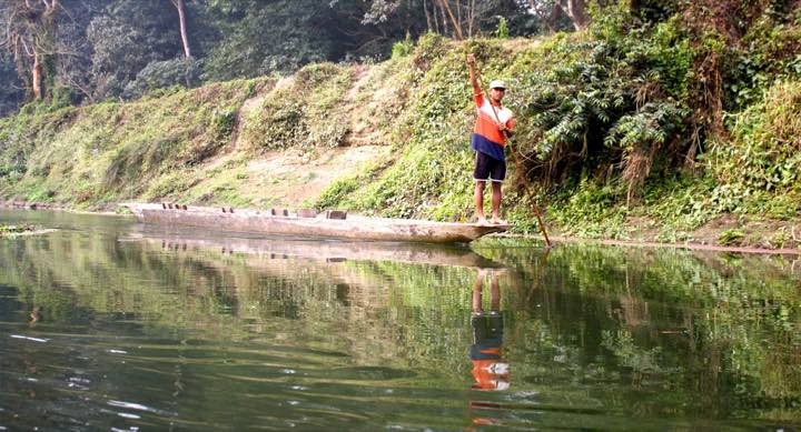 A wooden canoe on calm water